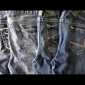 Lot of four pairs of jeans. A/E, Express, Silver.